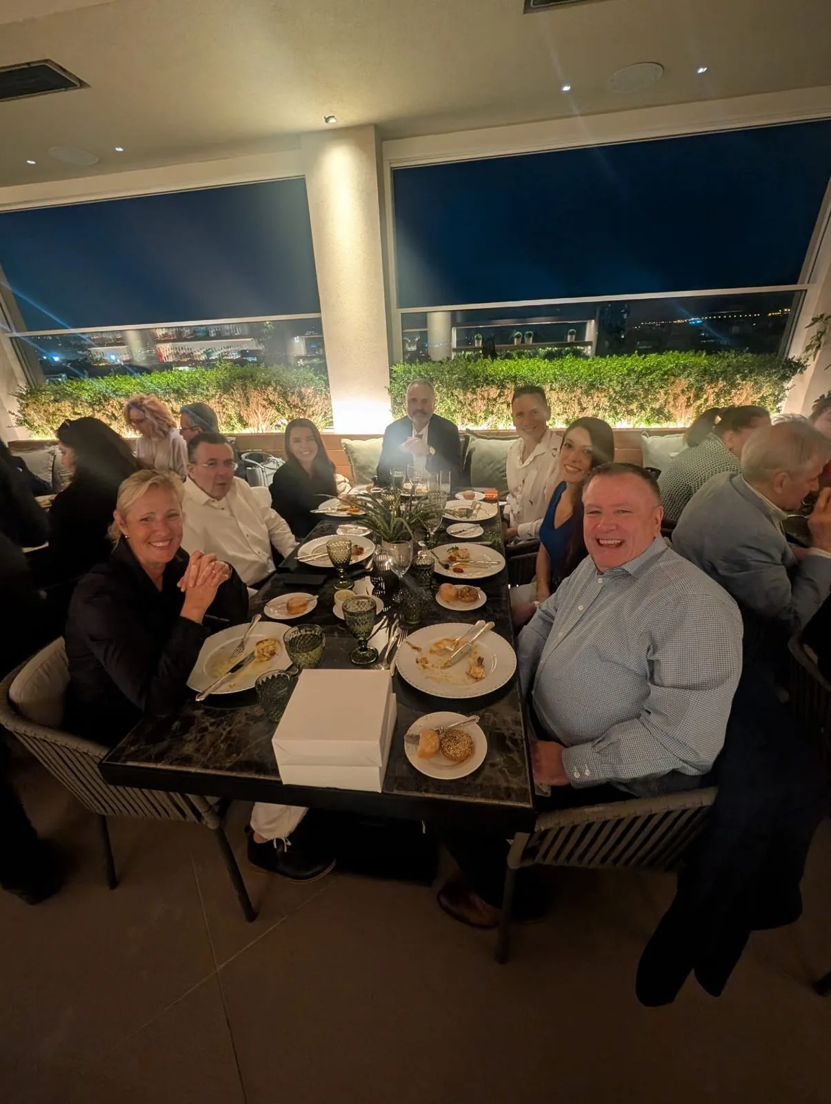 Members in conversation over dinner during the conference